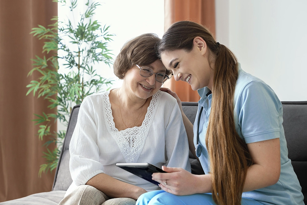 Women looking at tablet with digital diary